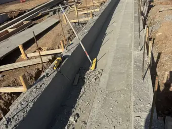 Curb form trench, sidewalk and curb work in New York