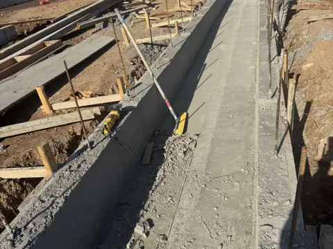 Curb form trench, sidewalk and curb work in New York