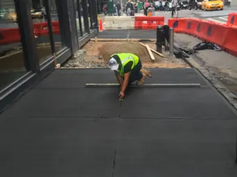 Sidewalk finishing crew, sidewalk and curb work in New York