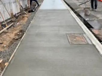 Sidewalk pour crew, sidewalk and curb work in New York