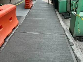 Sidewalk shed walk, sidewalk and curb work in New York